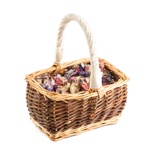 A Baby Basket containing Rainbow Delphinium & Wildflower Petals.